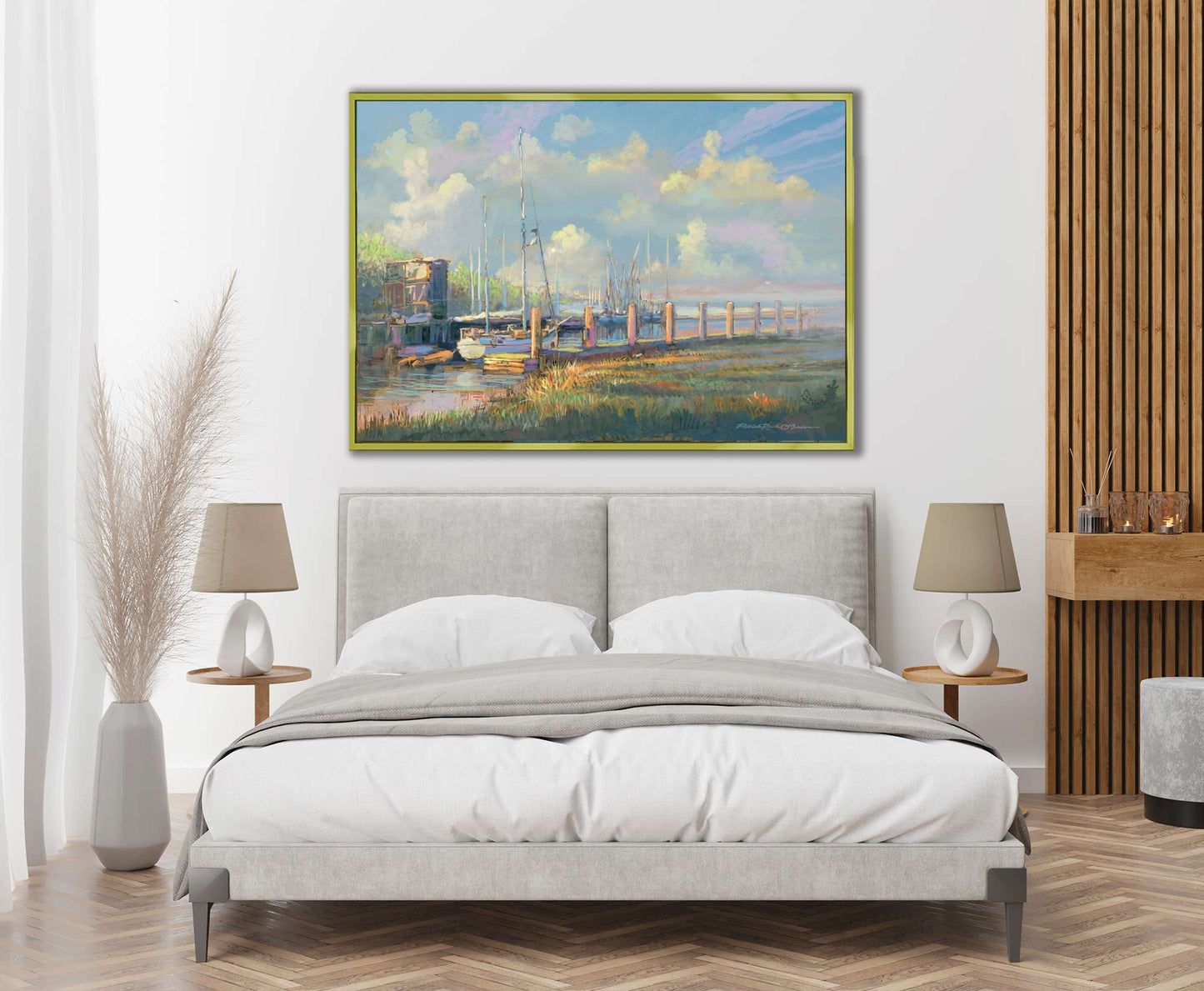 Modern bedroom with a bed, side tables, and a large painting of a dock scene by Patrick reid O'Brien.