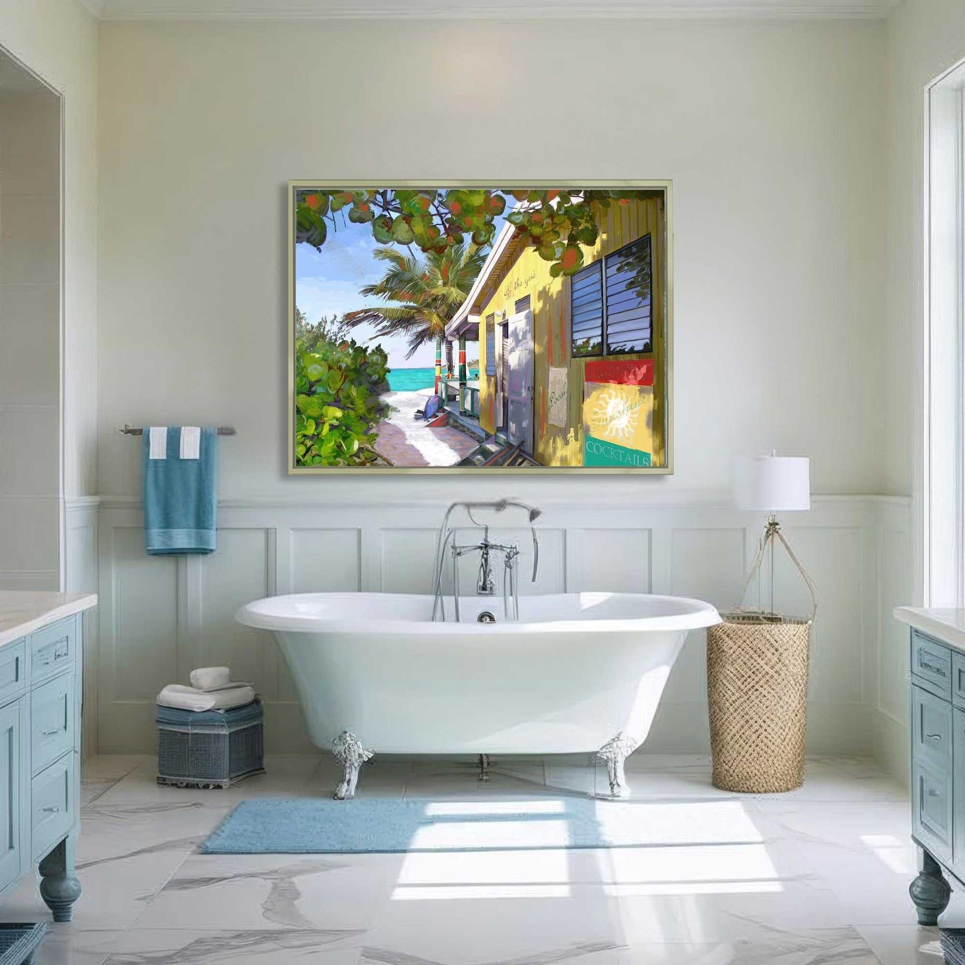 Bathroom with a freestanding bathtub, towel rack, and framed artwork of a beach scene.