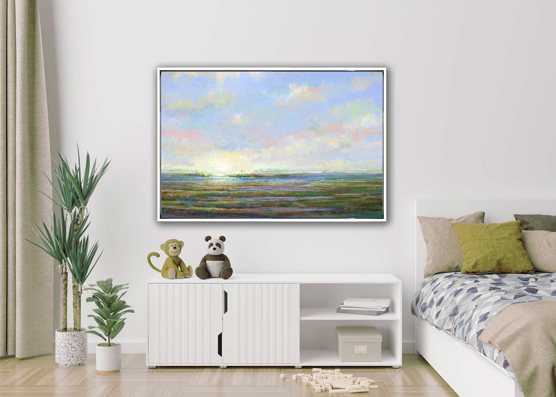Framed landscape painting above a white entertainment console in a living room.