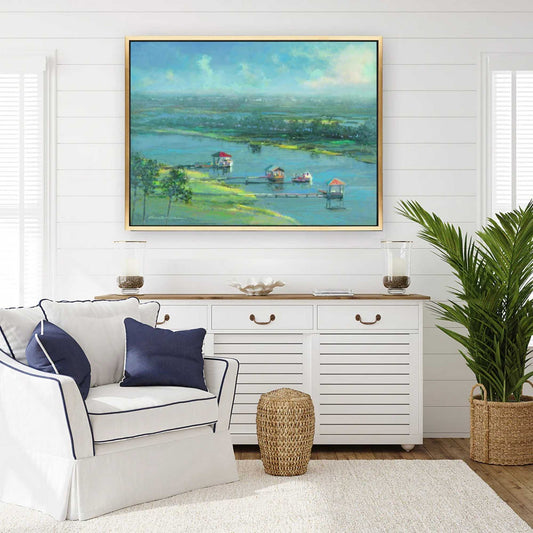 Living room with a white sofa, decorative pillows, a sideboard, and a large landscape by Patrick Reid O'Brien on the wall.
