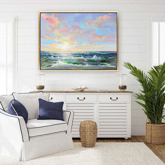 Living room with a white sofa, decorative pillows, a sideboard, and a large framed painting of a colorful sky and ocean.